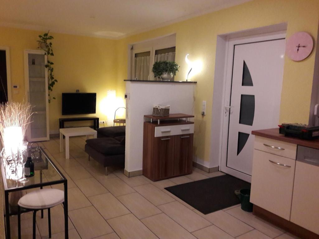 a living room with a door leading to a living room at feWo-zum Blauenblick in Buggingen