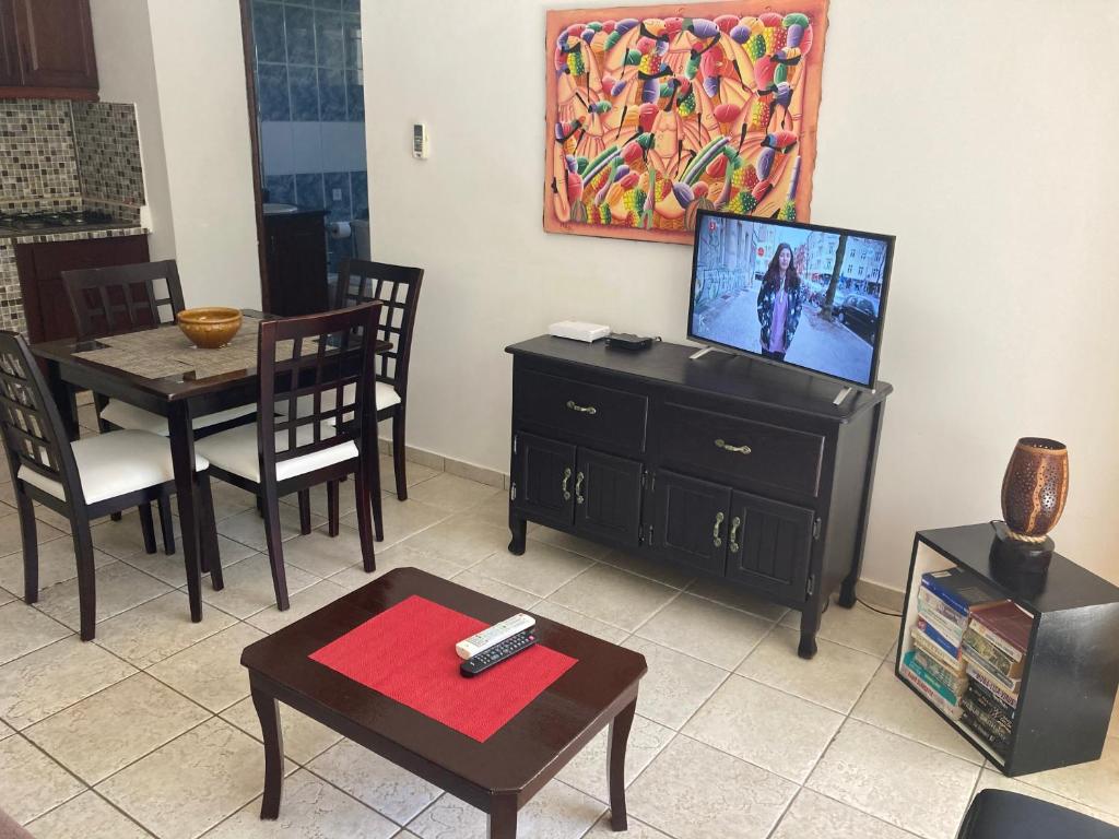 TV a/nebo společenská místnost v ubytování Cita del Sol City Apartments