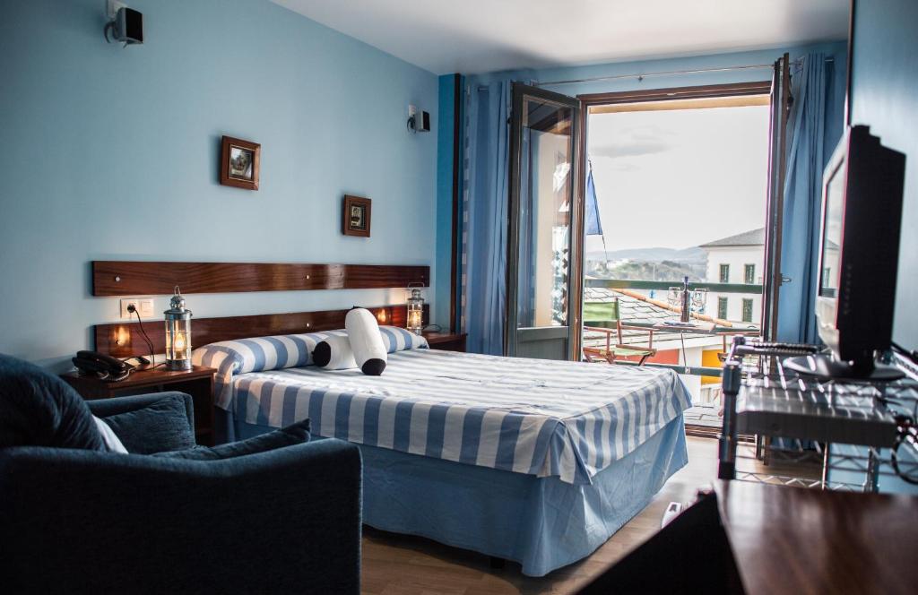 Postel nebo postele na pokoji v ubytování Hotel A. G. Porcillan