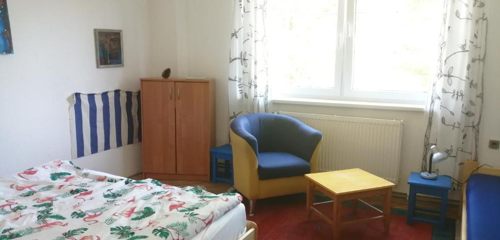 Postel nebo postele na pokoji v ubytování Keramický a výtvarný ateliér Konešín