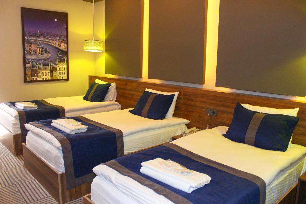 A bed or beds in a room at Grand Catalkaya Hotel