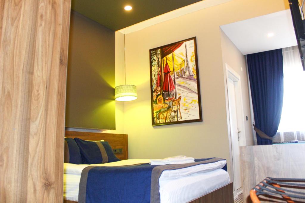 A bed or beds in a room at Grand Catalkaya Hotel