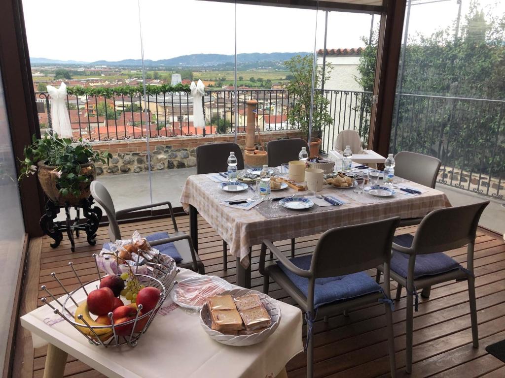 a table with food on top of a balcony at B&B ALLE SCALETTE in Trissino