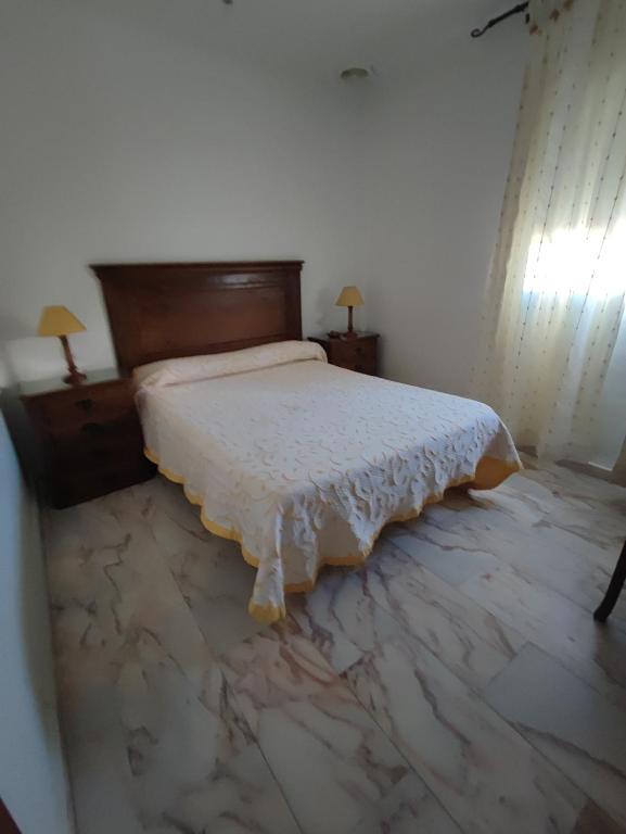 Posteľ alebo postele v izbe v ubytovaní Hotel Cervantes