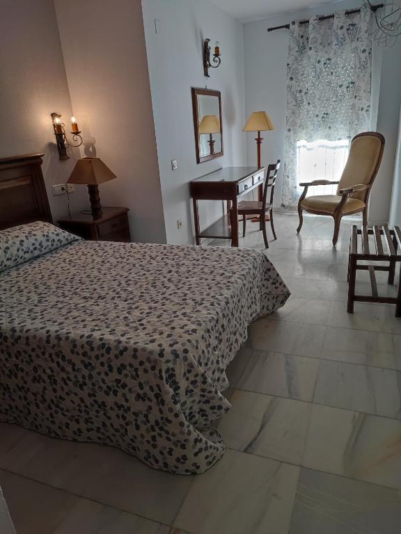 Posteľ alebo postele v izbe v ubytovaní Hotel Cervantes