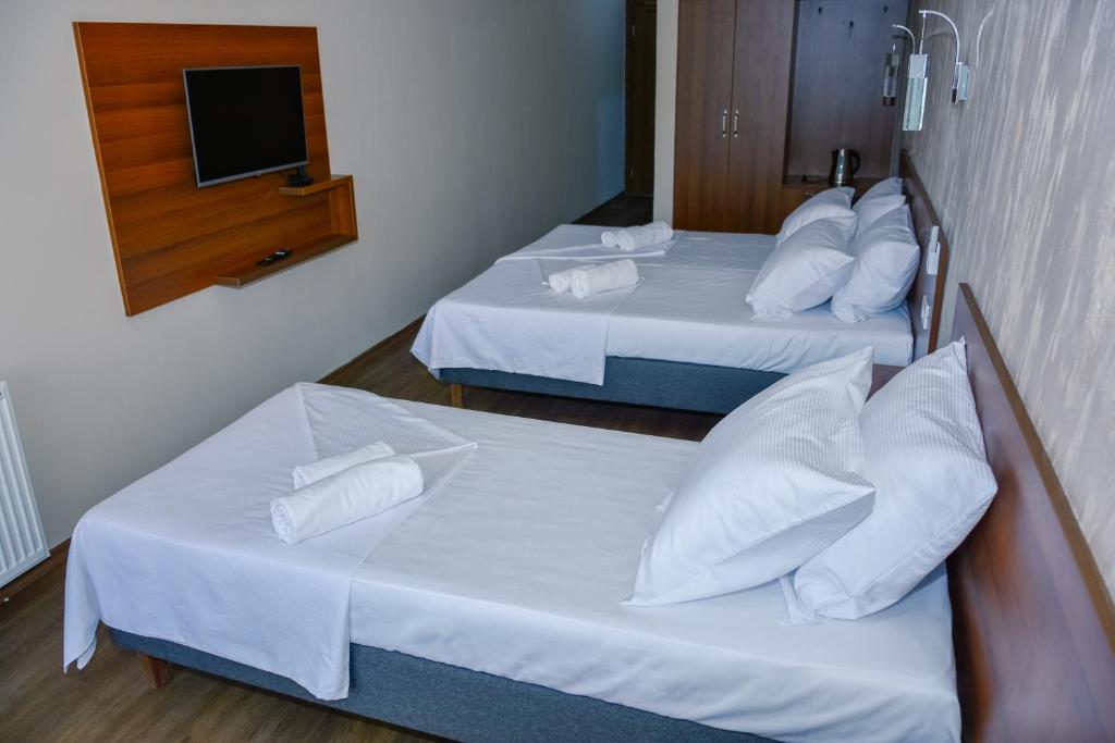 Postel nebo postele na pokoji v ubytování Hotel Story
