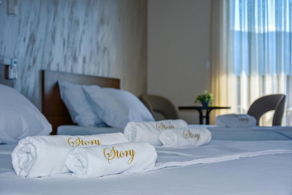 Postel nebo postele na pokoji v ubytování Hotel Story