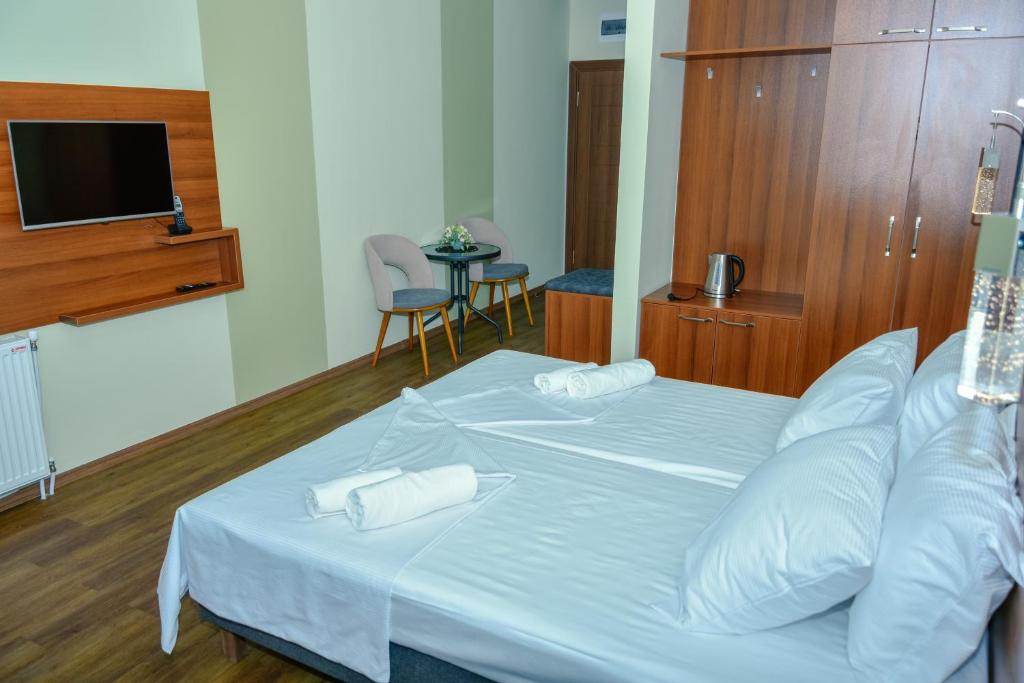 Postel nebo postele na pokoji v ubytování Hotel Story