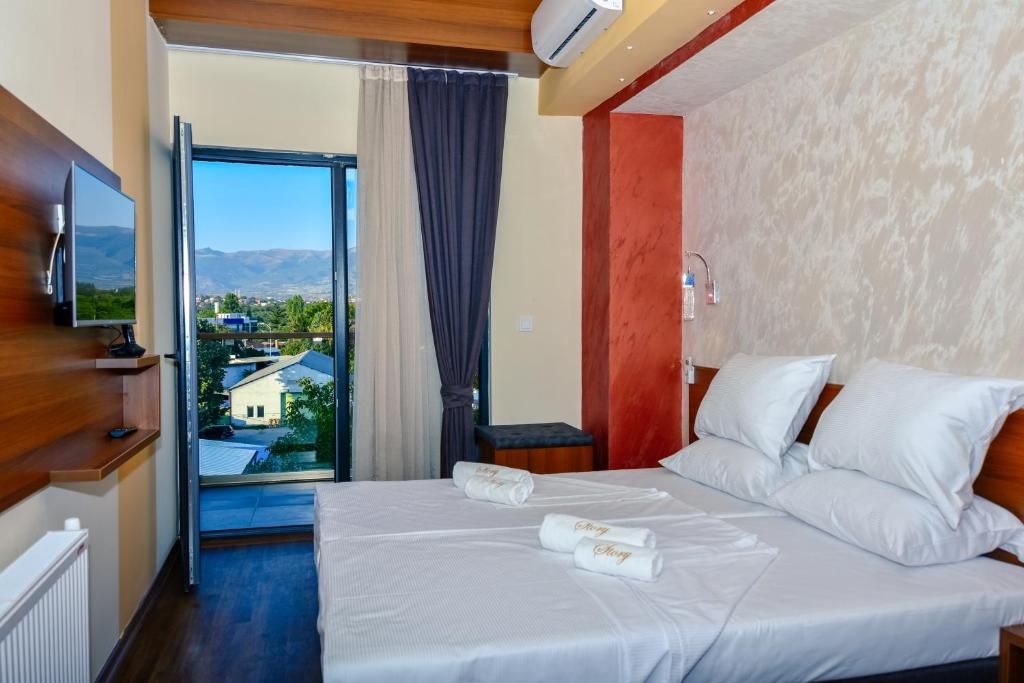 Postel nebo postele na pokoji v ubytování Hotel Story