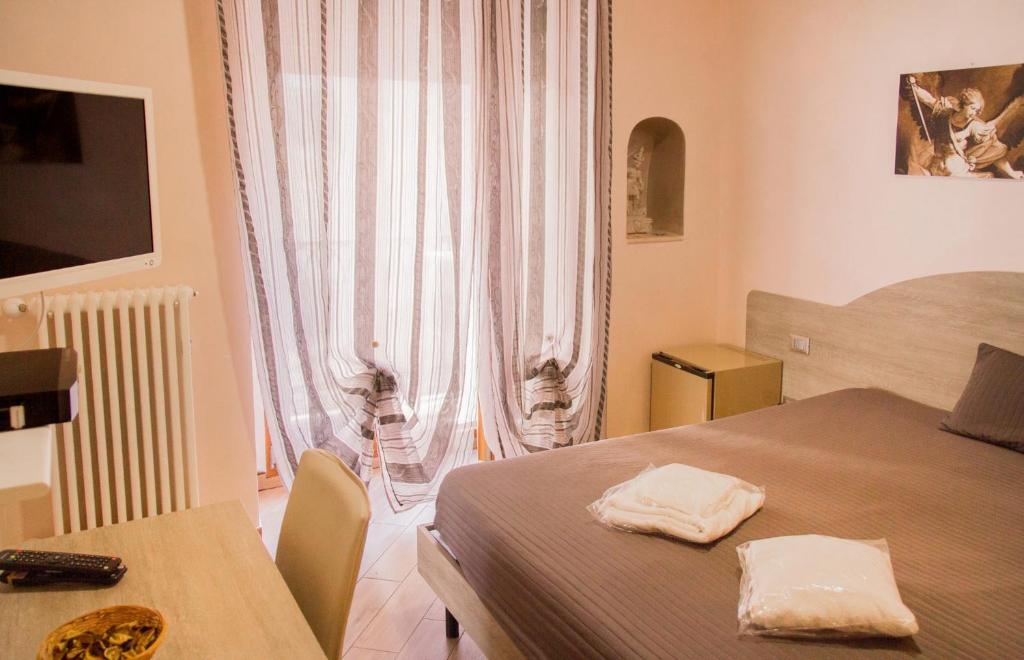 Postel nebo postele na pokoji v ubytování Rooms Gli Arcangeli - Affitti Brevi Italia