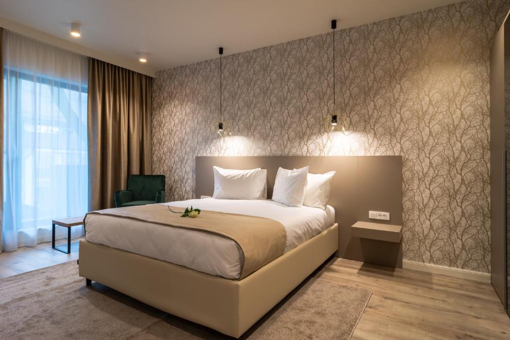 Un pat sau paturi într-o cameră la Aparthotel NOX