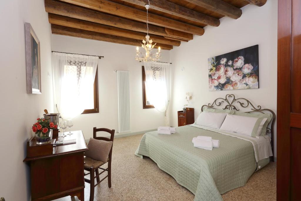 Postel nebo postele na pokoji v ubytování Ca' del Pittor Apartments