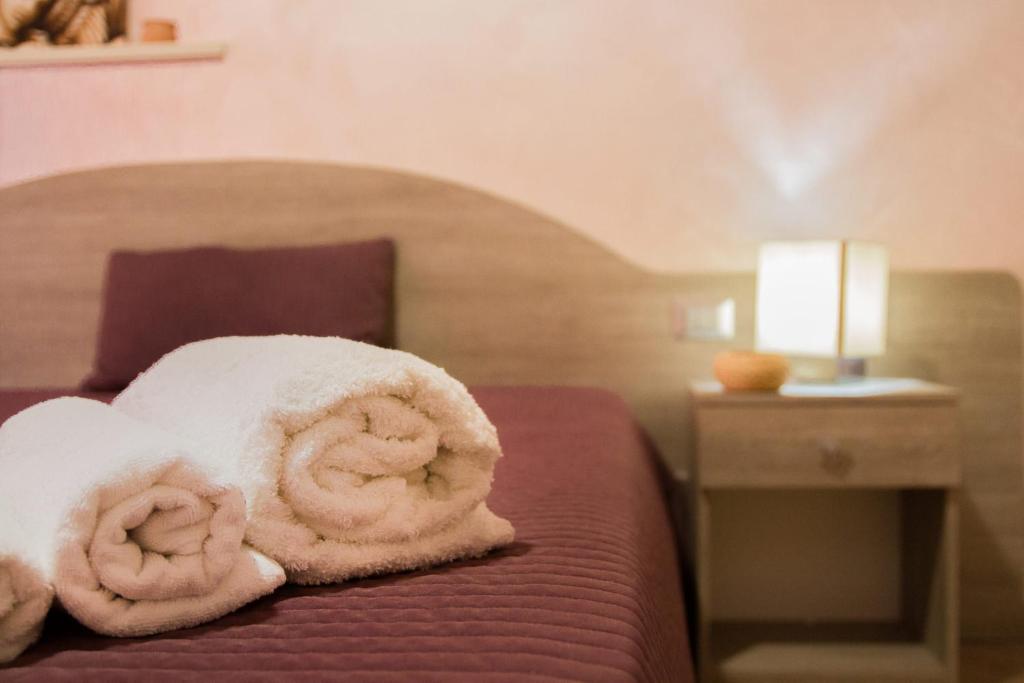 Postel nebo postele na pokoji v ubytování Rooms Gli Arcangeli - Affitti Brevi Italia