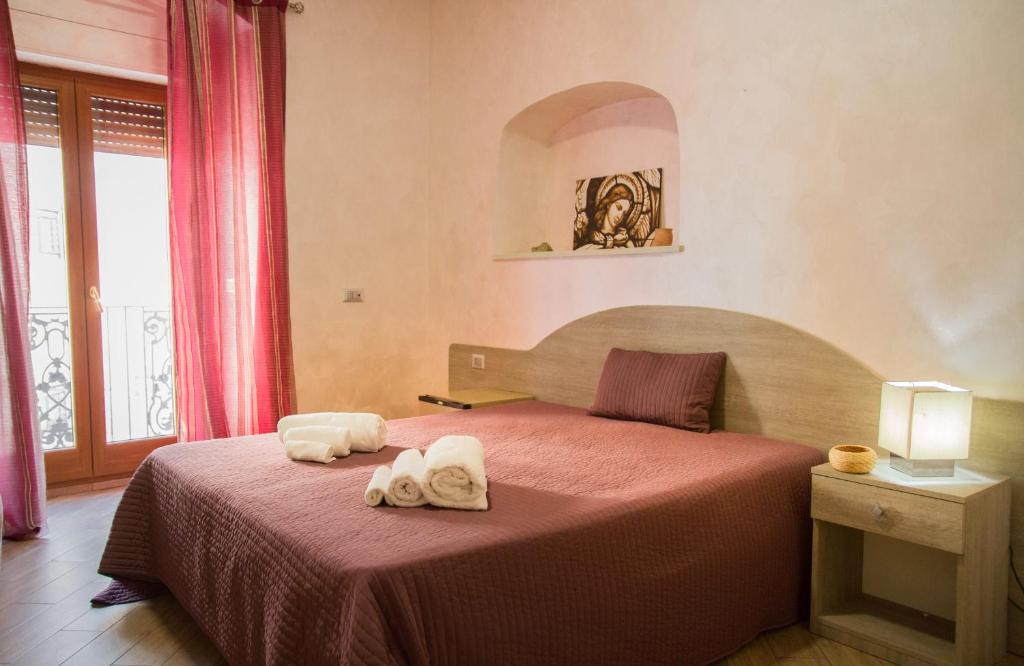 Postel nebo postele na pokoji v ubytování Rooms Gli Arcangeli - Affitti Brevi Italia