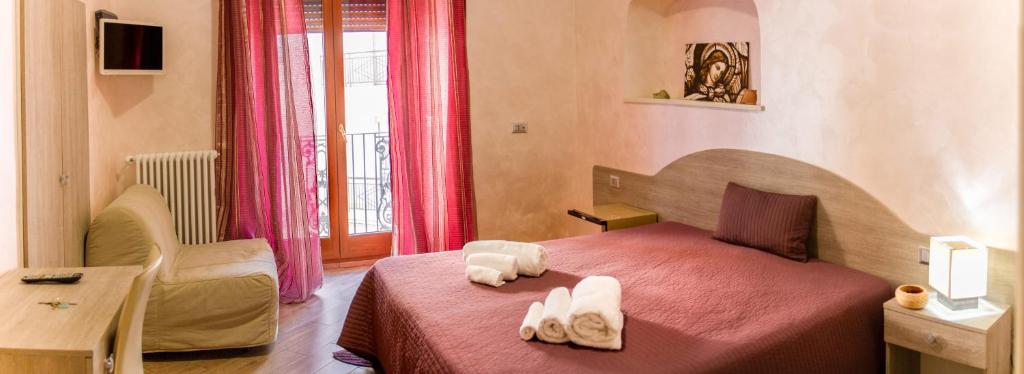 Postel nebo postele na pokoji v ubytování Rooms Gli Arcangeli - Affitti Brevi Italia