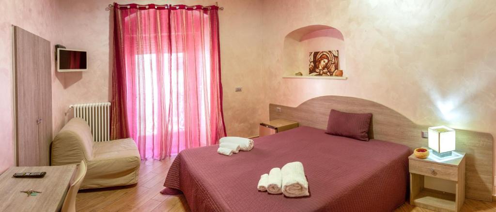 Postel nebo postele na pokoji v ubytování Rooms Gli Arcangeli - Affitti Brevi Italia