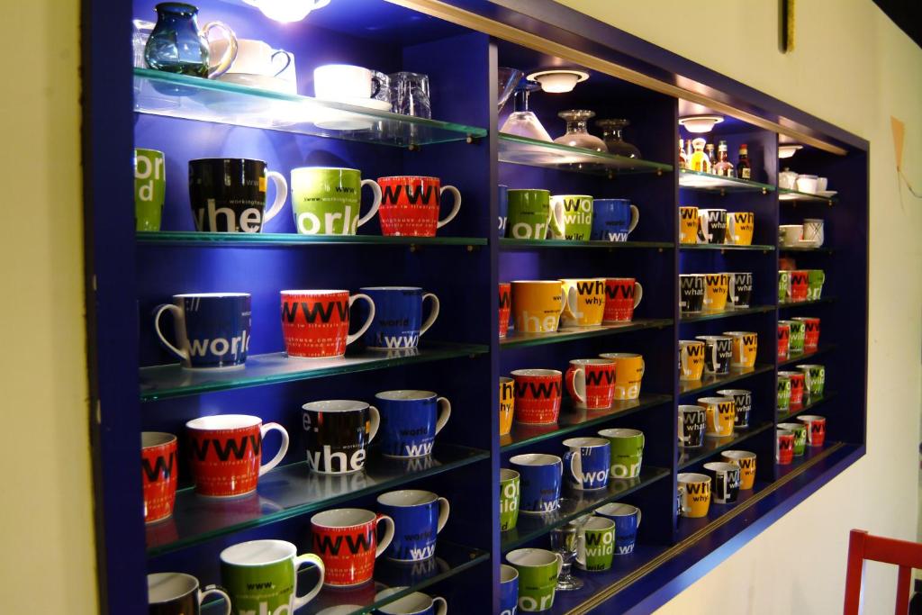 a display of mugs on shelves in a store at Hwa Hong Hotel in Kaohsiung