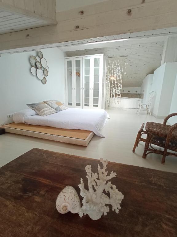 Postel nebo postele na pokoji v ubytování Hosteria de Arnuero