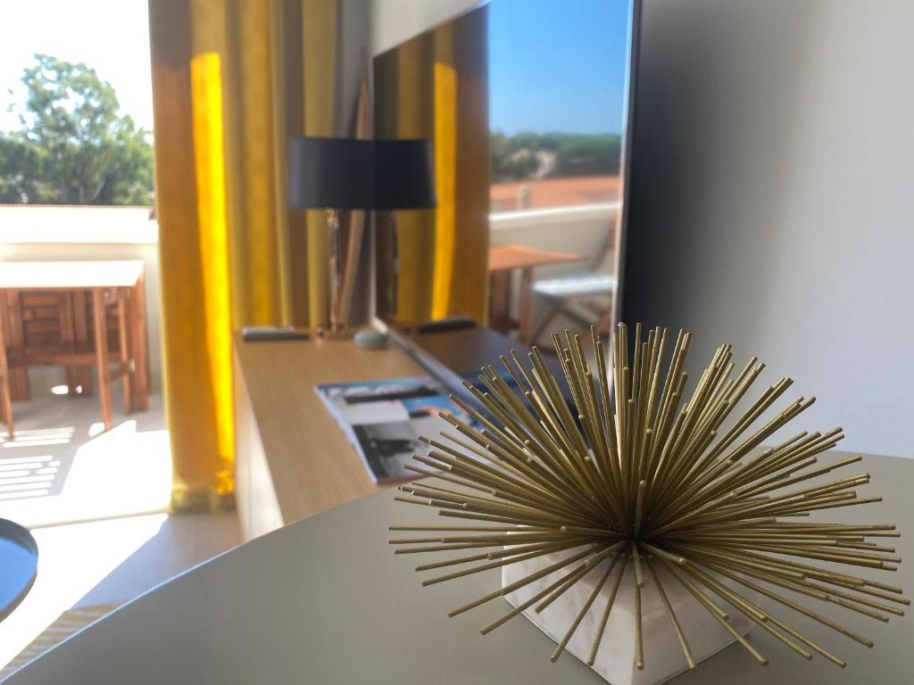 a sun decoration on a table in a room at Ocean view, Luxury & Relax Dunas de Artola in Marbella