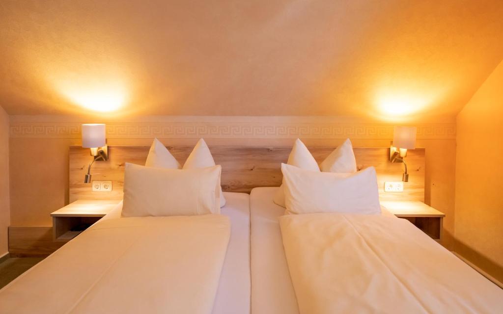 Postel nebo postele na pokoji v ubytování Hotel Zum Steinhof