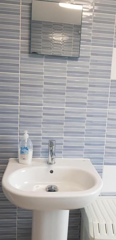 A bathroom at Stylish Apartment