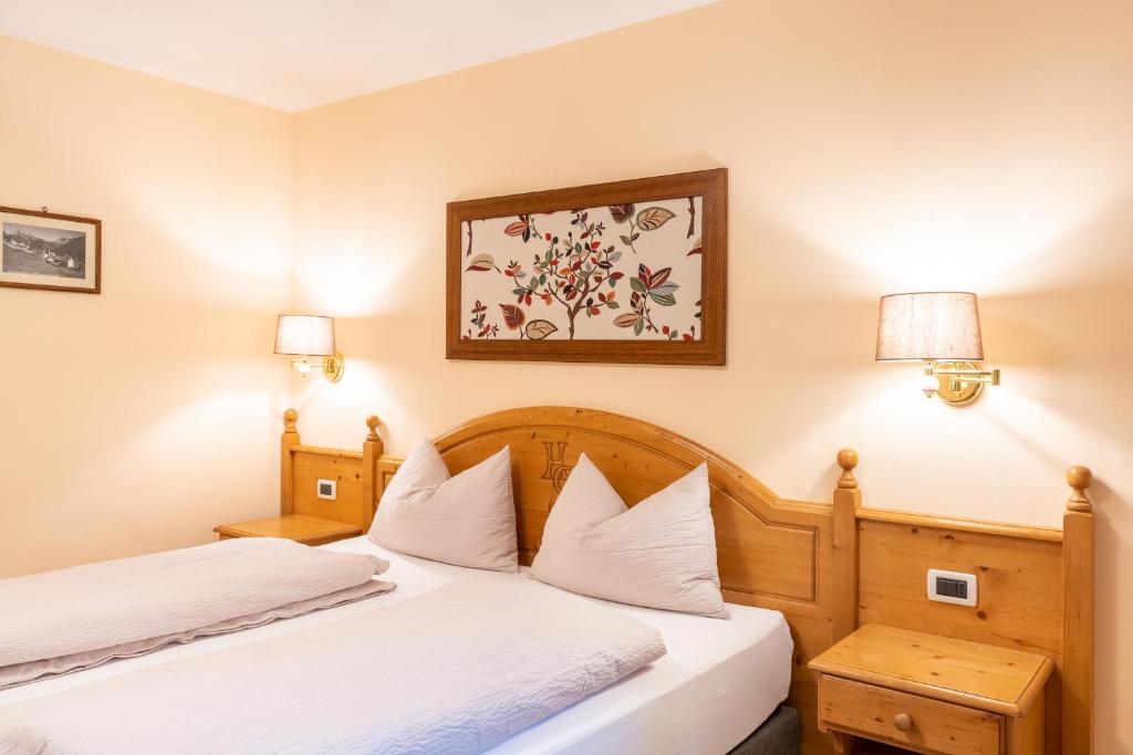 Postel nebo postele na pokoji v ubytování Albergo Conturina