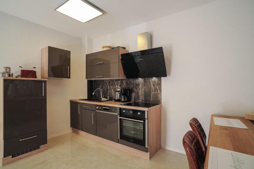 Kuchyň nebo kuchyňský kout v ubytování Designpension Idyll Nr21 Hotel Garni