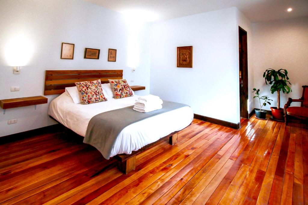 Postel nebo postele na pokoji v ubytování Casa California Guesthouse