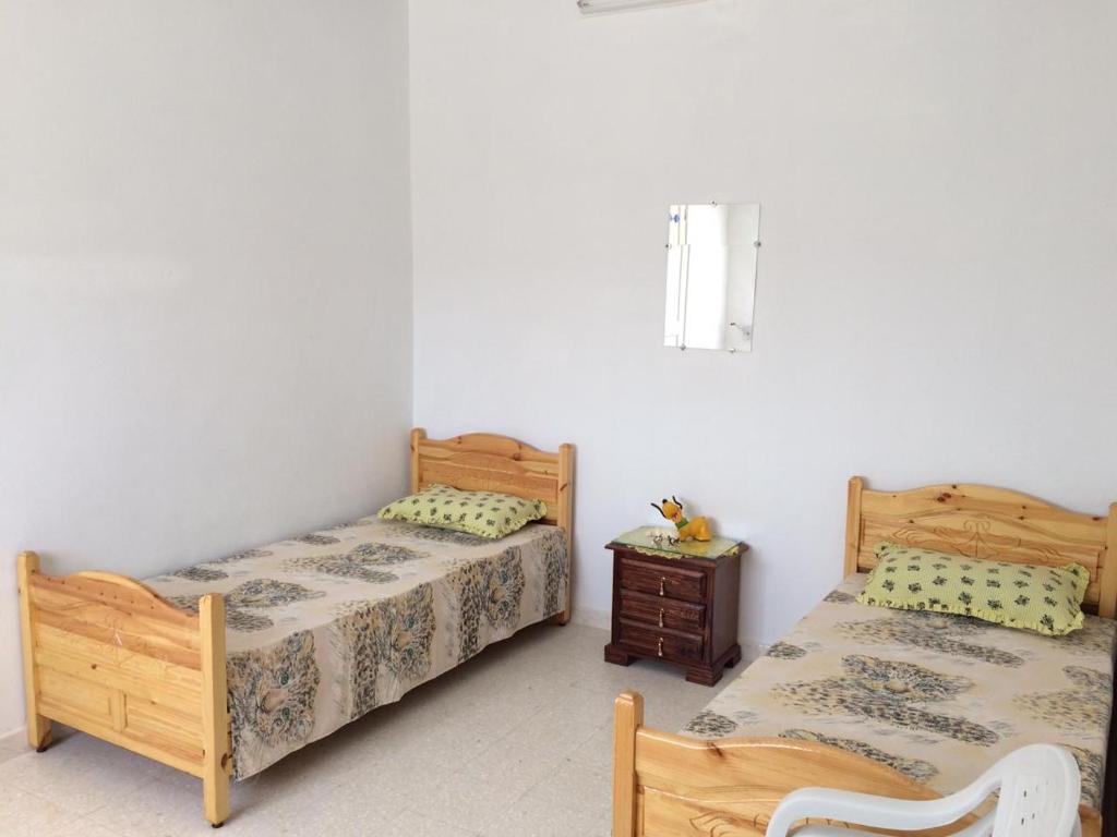 Postel nebo postele na pokoji v ubytování Kélibia Paradise