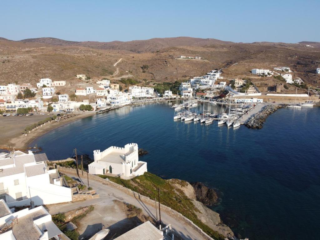 an aerial view of a harbor with white buildings at Aiolos Studios Κythnos in Kithnos