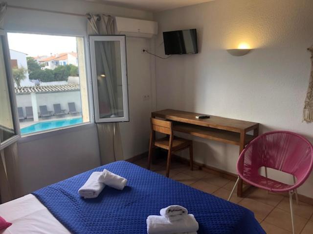 Postel nebo postele na pokoji v ubytování Hotel Le Bleu Marine