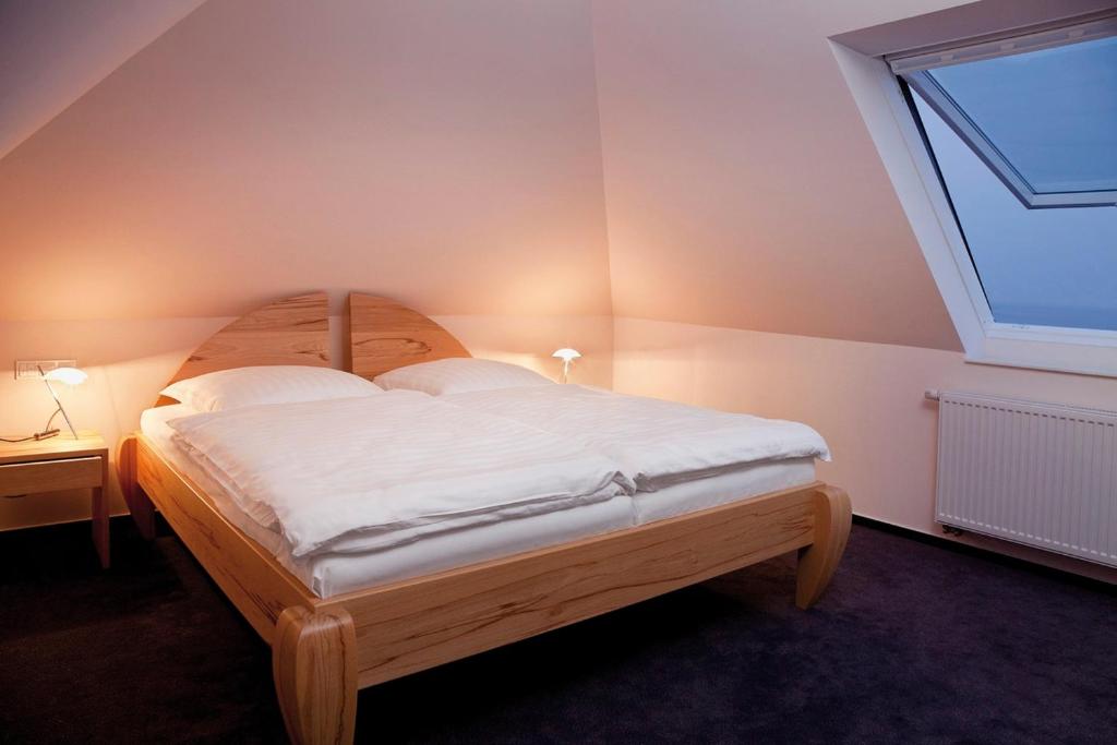 Ένα ή περισσότερα κρεβάτια σε δωμάτιο στο Kormoran