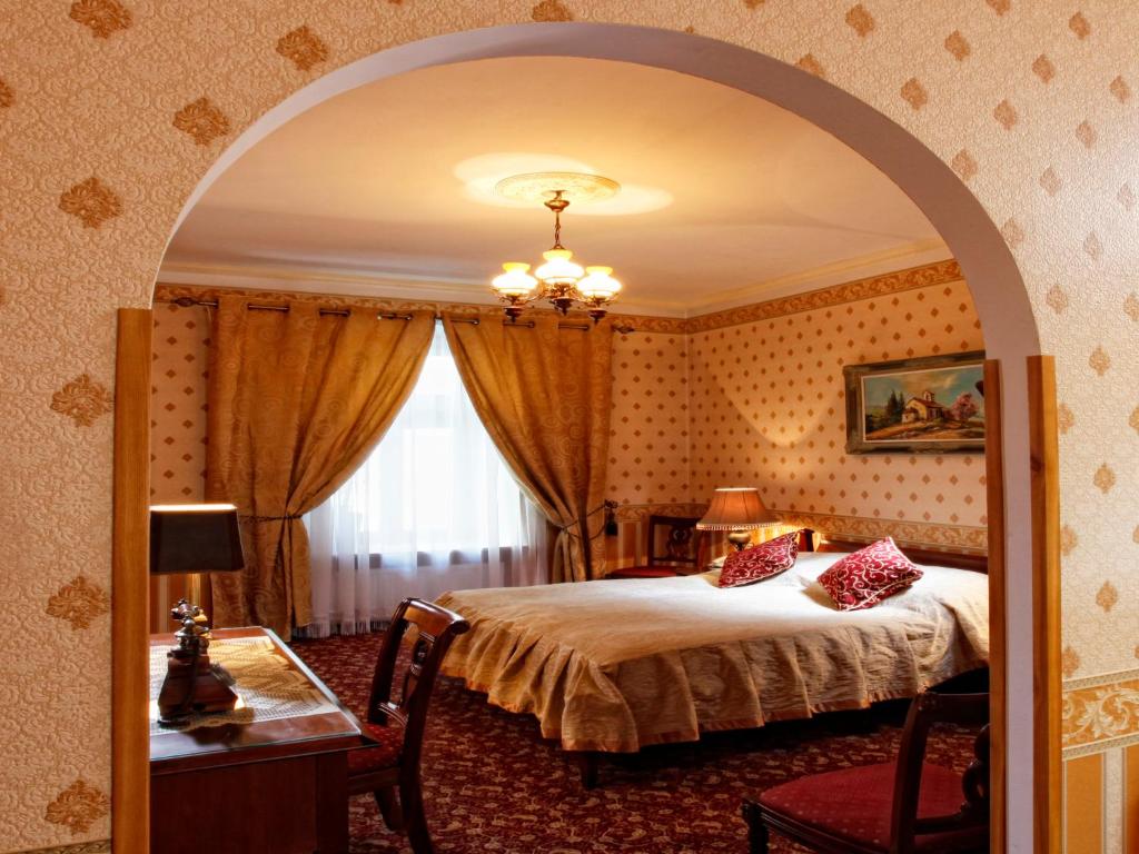 Posteľ alebo postele v izbe v ubytovaní Hotel Europejski