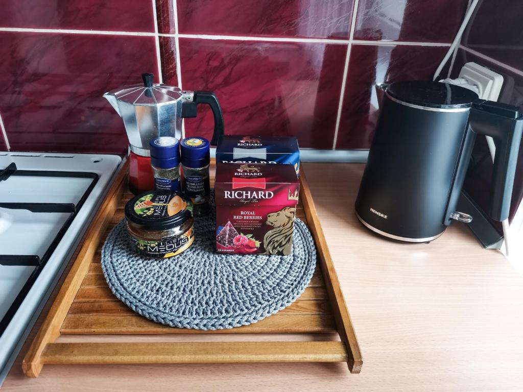 a counter with a tray with food and a blender at The good stay in Šiauliai