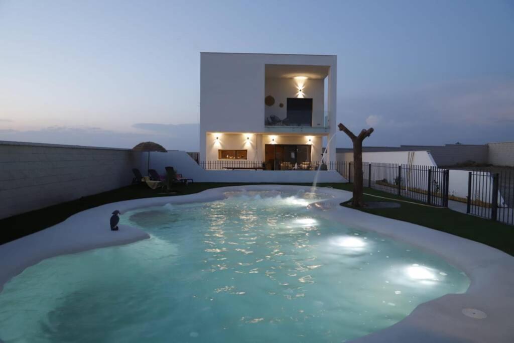 a swimming pool on the roof of a house at Casa Rural Alegría de Toledo, Guadamur,Puy du Fou in Guadamur