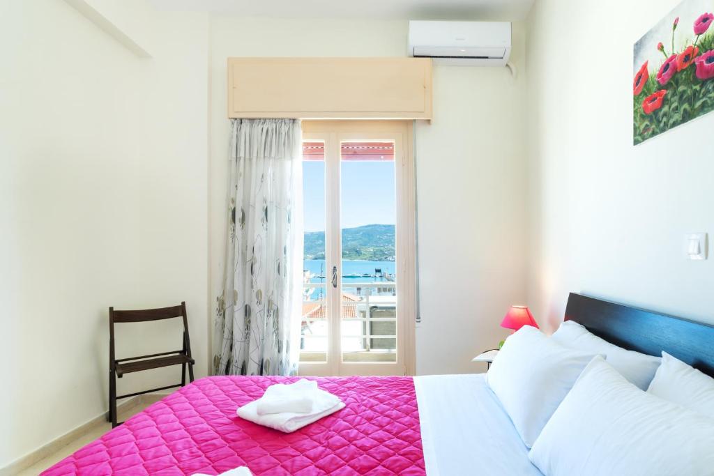 Postel nebo postele na pokoji v ubytování Aloe Apartments