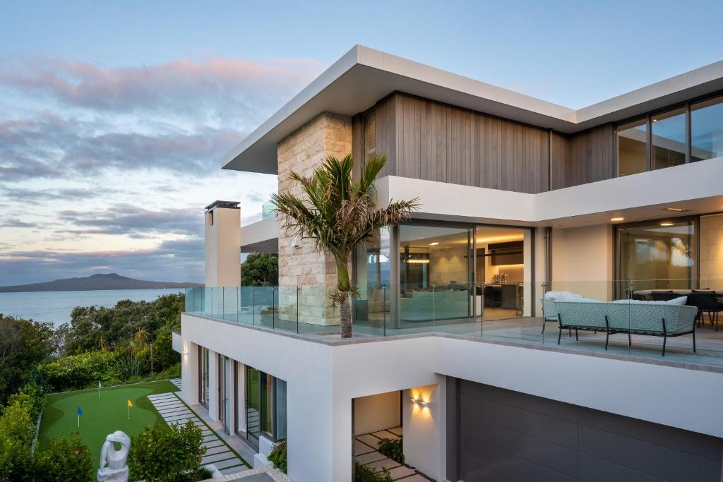 a house with a view of the ocean at Elements of Castor Bay in Auckland