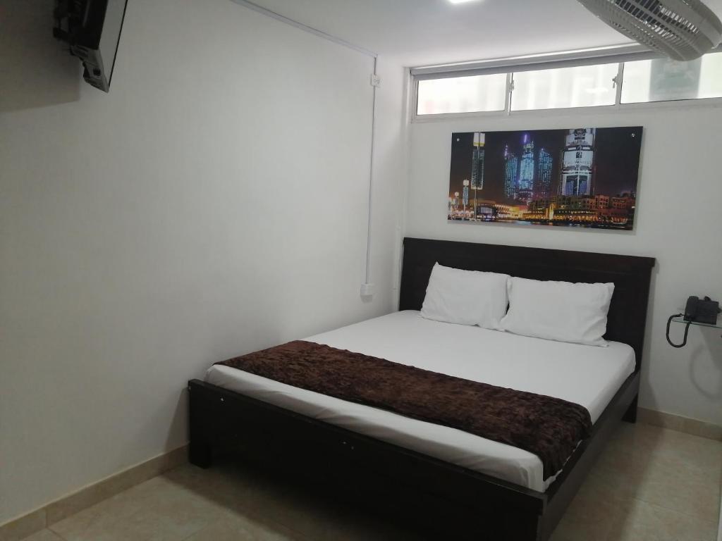 Postel nebo postele na pokoji v ubytování Hotel Sol del Estadio