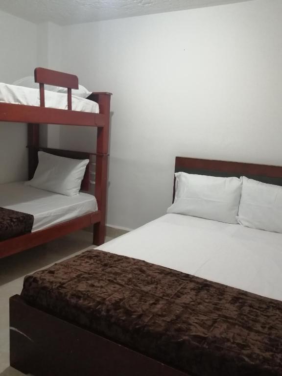 Postel nebo postele na pokoji v ubytování Hotel Sol del Estadio