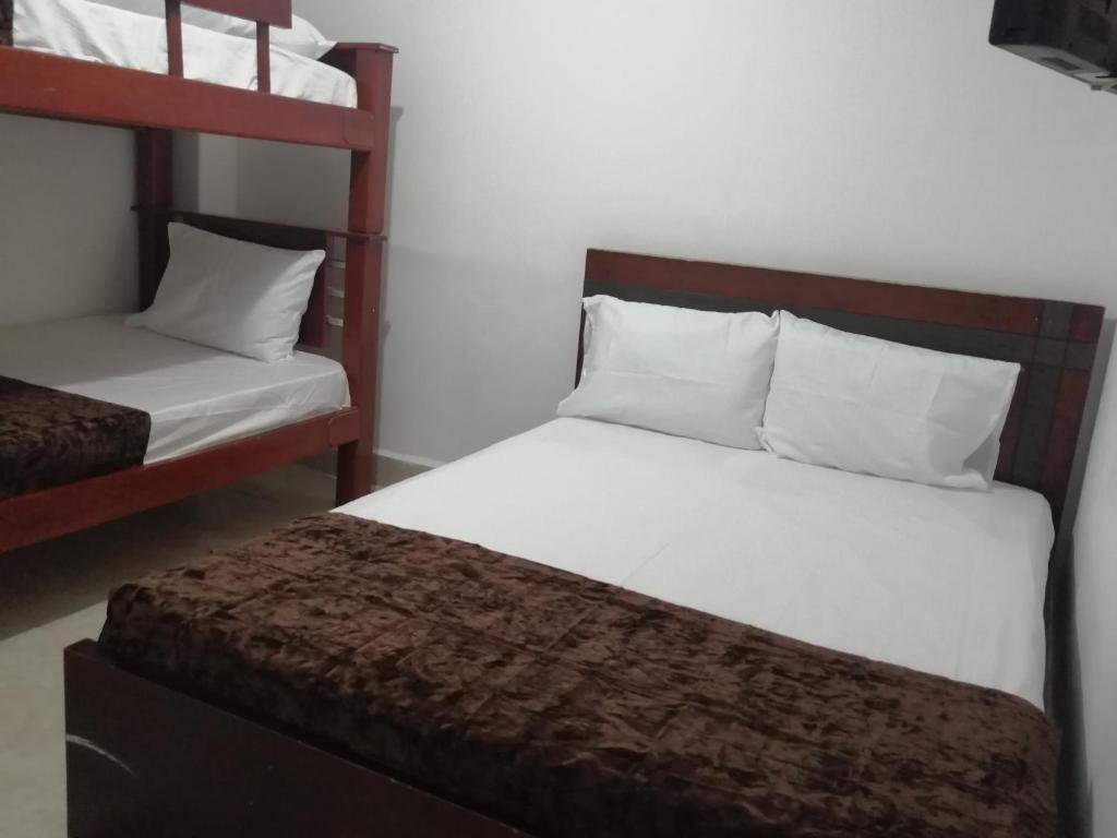 Postel nebo postele na pokoji v ubytování Hotel Sol del Estadio