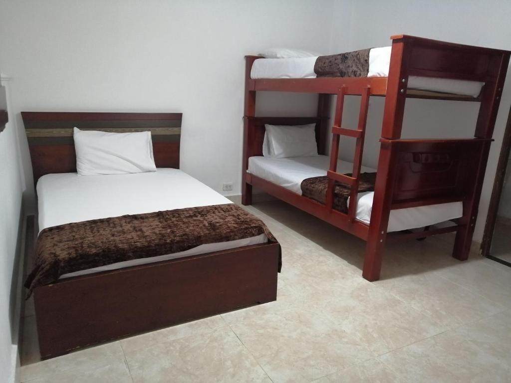 Postel nebo postele na pokoji v ubytování Hotel Sol del Estadio