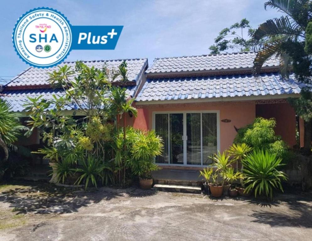 a house with a sign that says sta plus at Discovery House Hotel SHA Plus in Nai Yang Beach