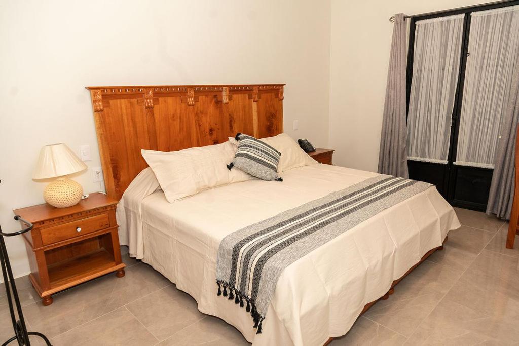 Postel nebo postele na pokoji v ubytování Hotel Danini
