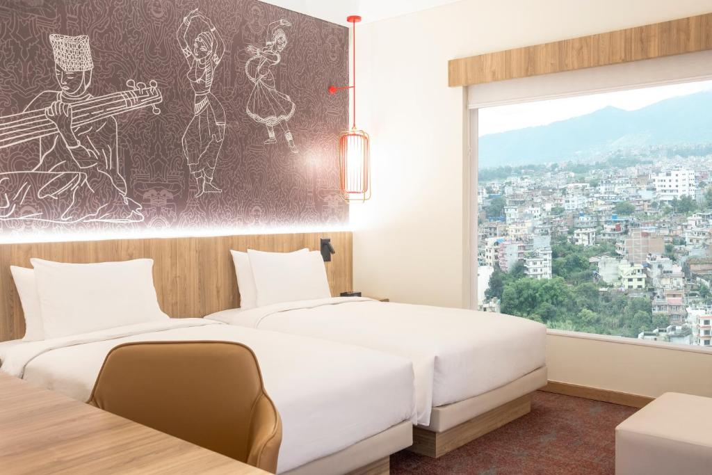 Postel nebo postele na pokoji v ubytování Hyatt Centric Soalteemode Kathmandu