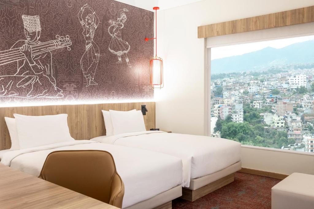 Postel nebo postele na pokoji v ubytování Hyatt Centric Soalteemode Kathmandu