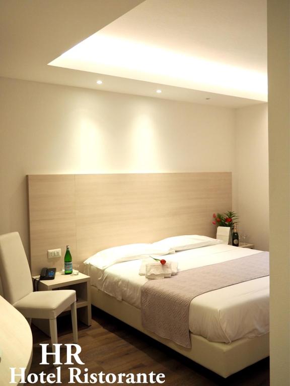Postel nebo postele na pokoji v ubytování Hotel Riposo