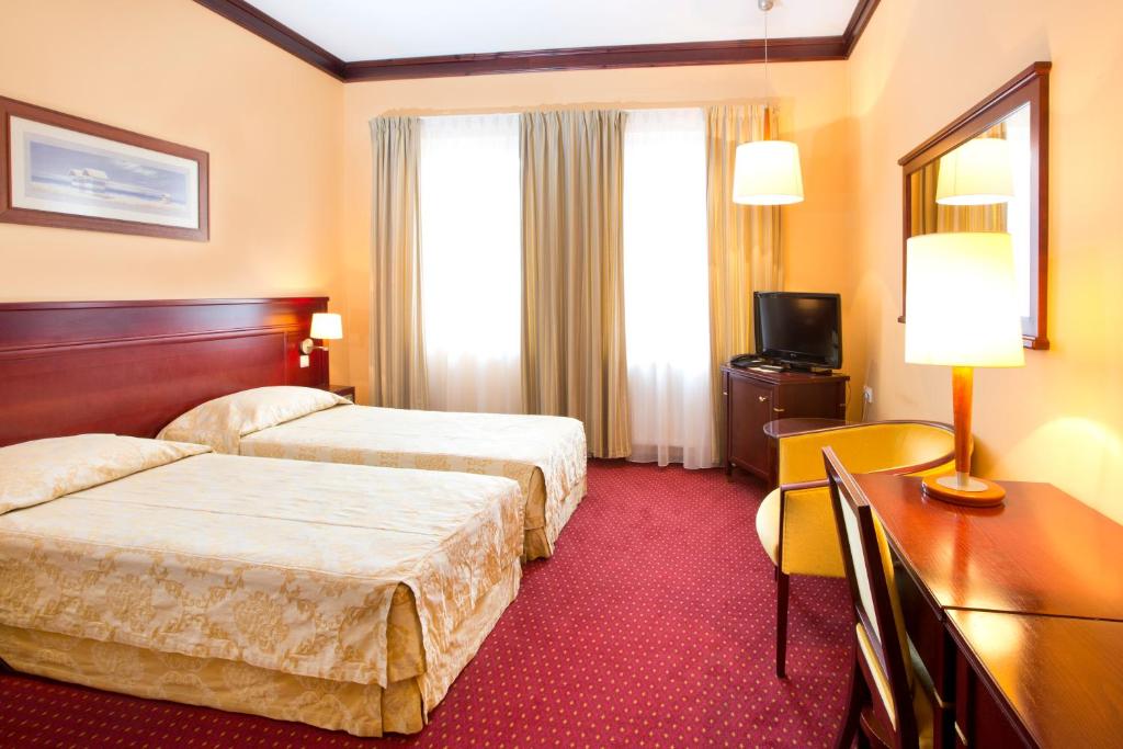 Ein Bett oder Betten in einem Zimmer der Unterkunft Meduza Hotel &amp; Spa