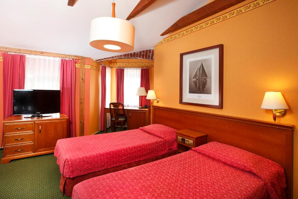 Postel nebo postele na pokoji v ubytování Meduza Hotel & Spa