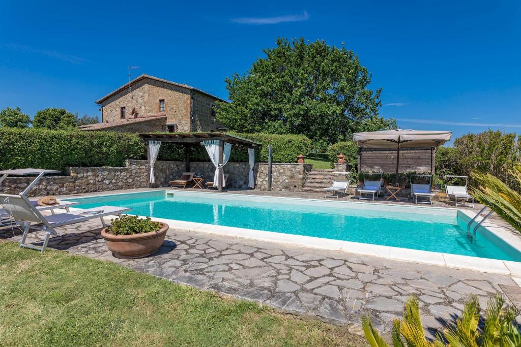 The swimming pool at or close to Casale del Viaggiatore 10, Emma Villas