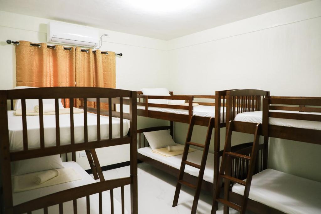 Postel nebo postele na pokoji v ubytování Yogi-Homestay